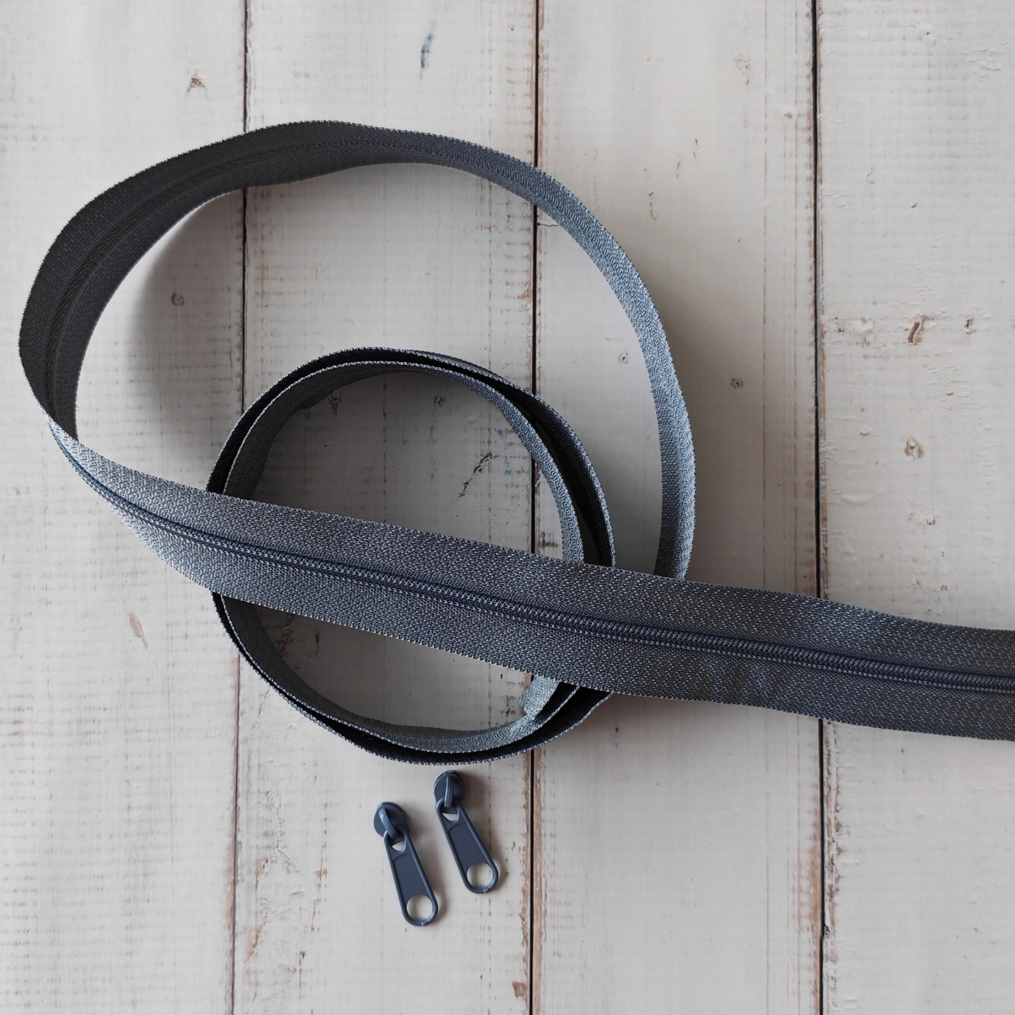 Dark grey zipper with 2 zipper pulls