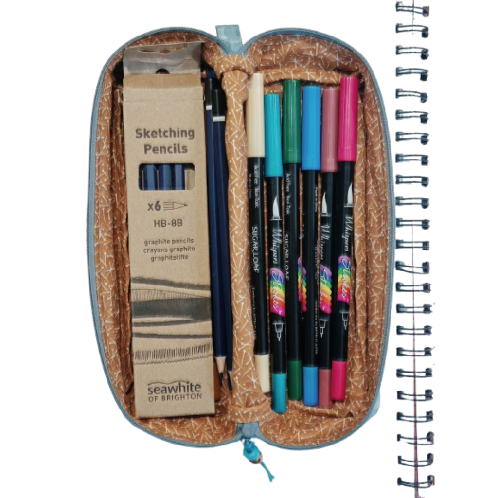 An open Boxy Pencil Pouch showing pens and pencils.