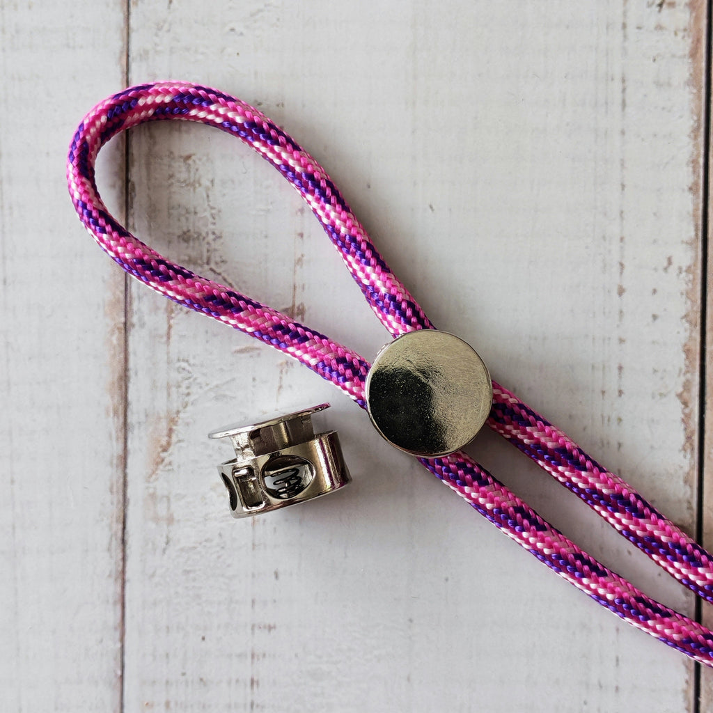 Pink and purple braided lanyard with metal cord locks.