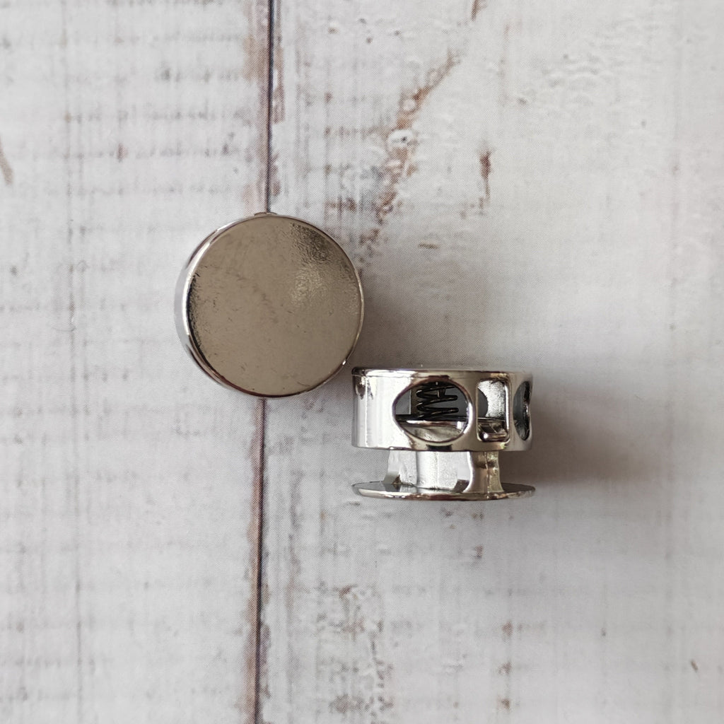 Metallic circular cord locks