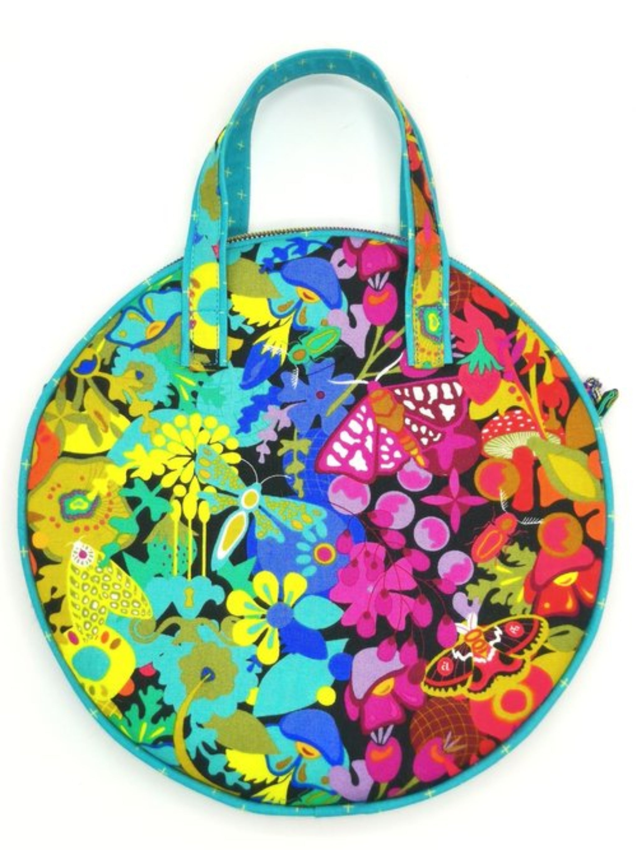 Colorful round bag with floral and abstract patterns on a white background