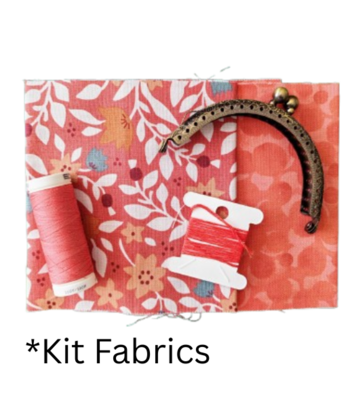 A fabric kit display featuring two patterned fabric swatches, one with a coral floral print and one with a coral spot print, a spool of coral thread, and a metal coin purse clasp. 
