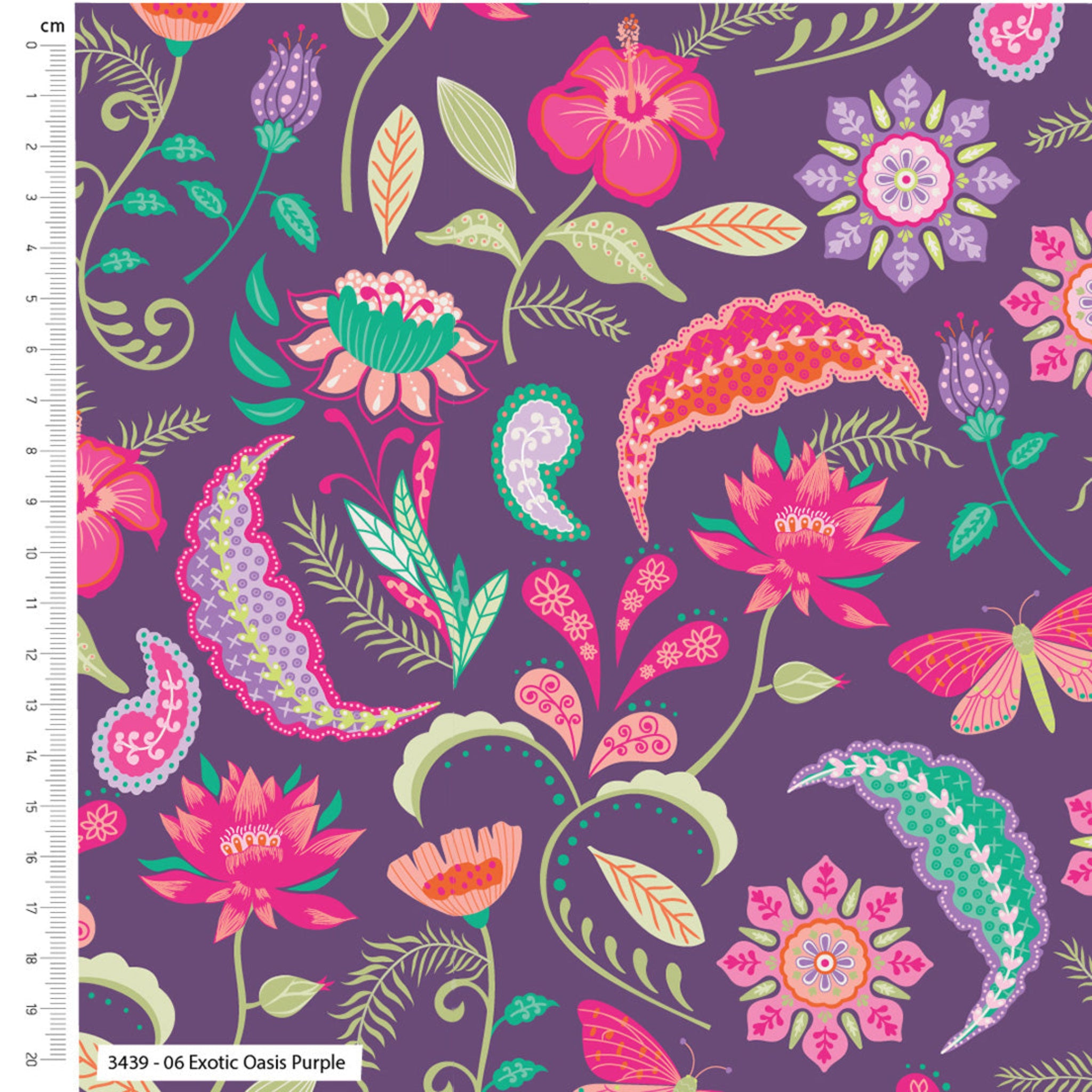 Colorful floral and paisley pattern on a purple background with a ruler for scale. 100% cotton fabric.