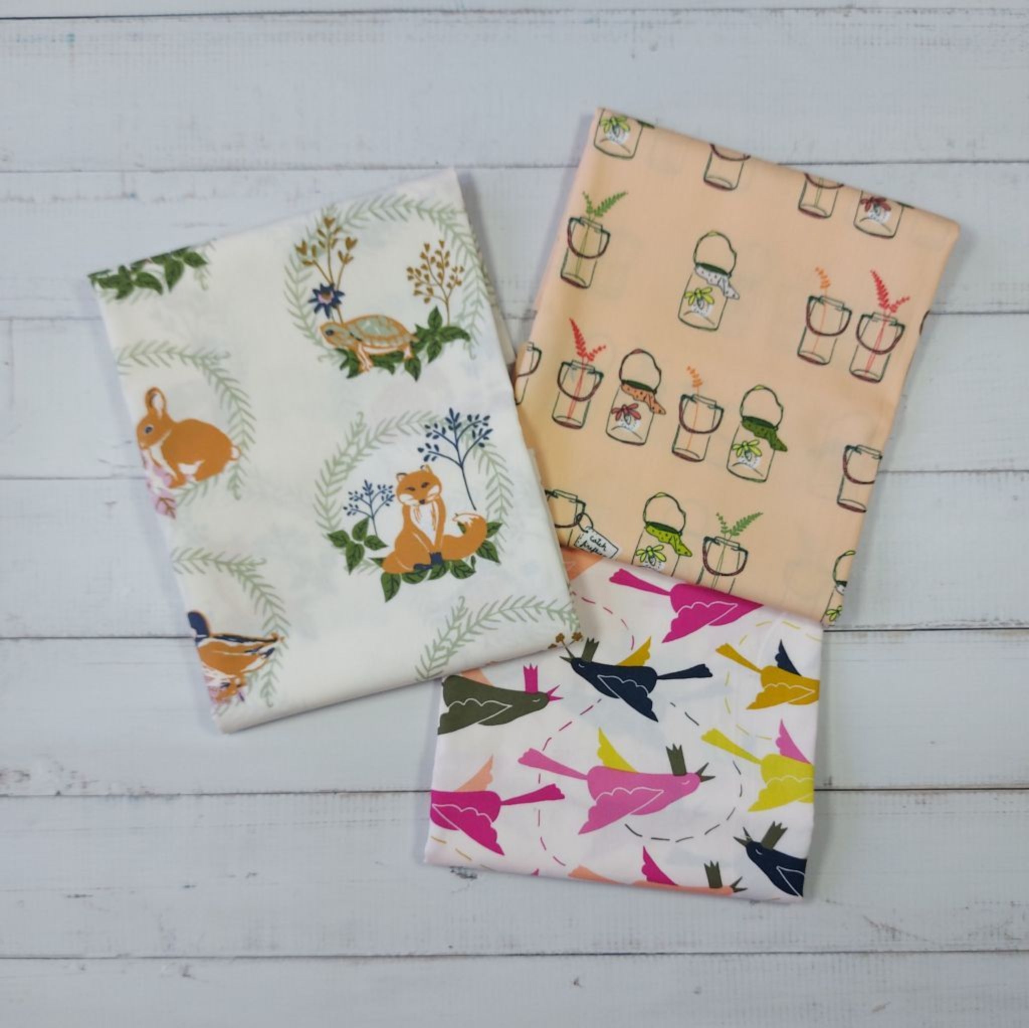 Three fabric swatches with animal and nature 
