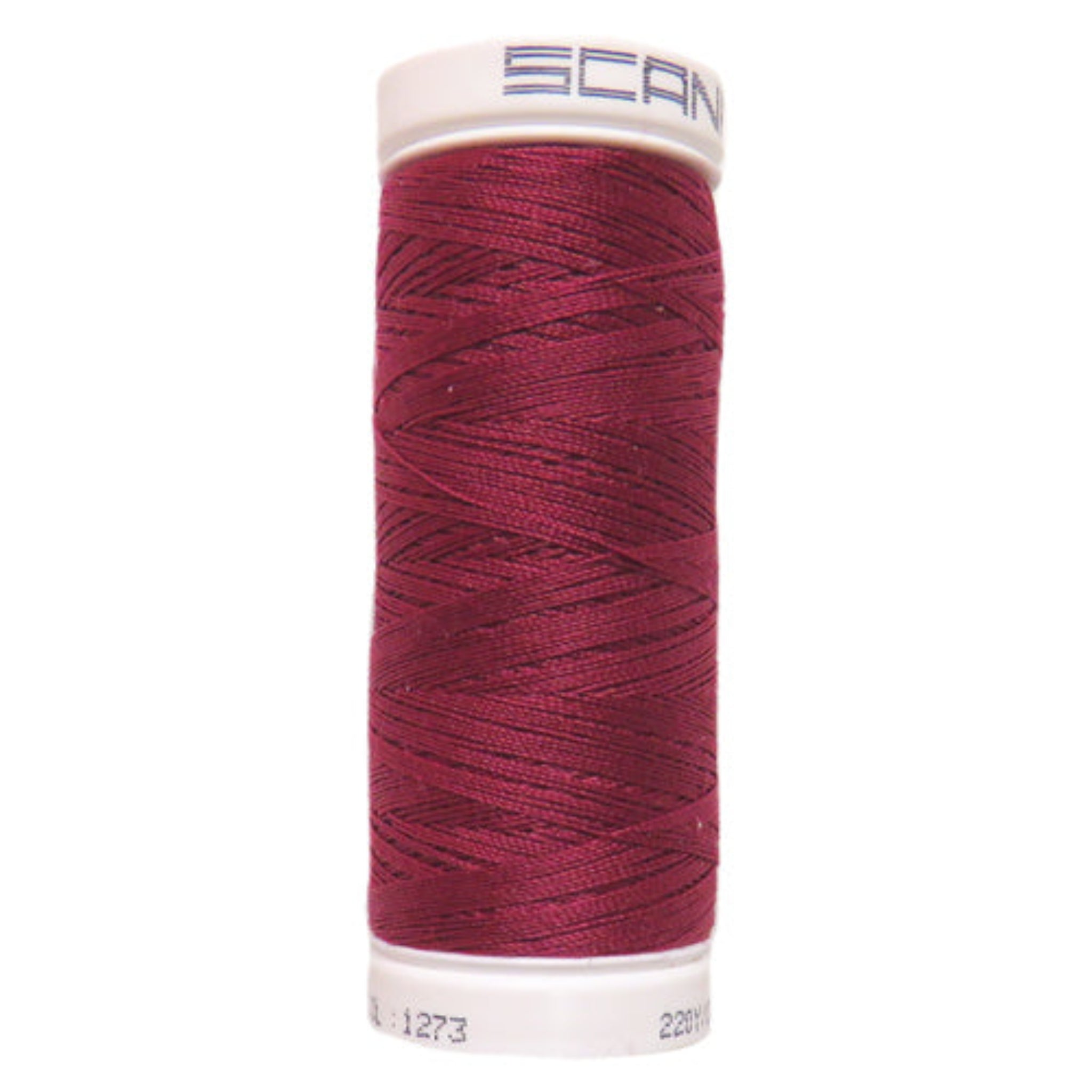 Spool of red thread with a white cap on a white background