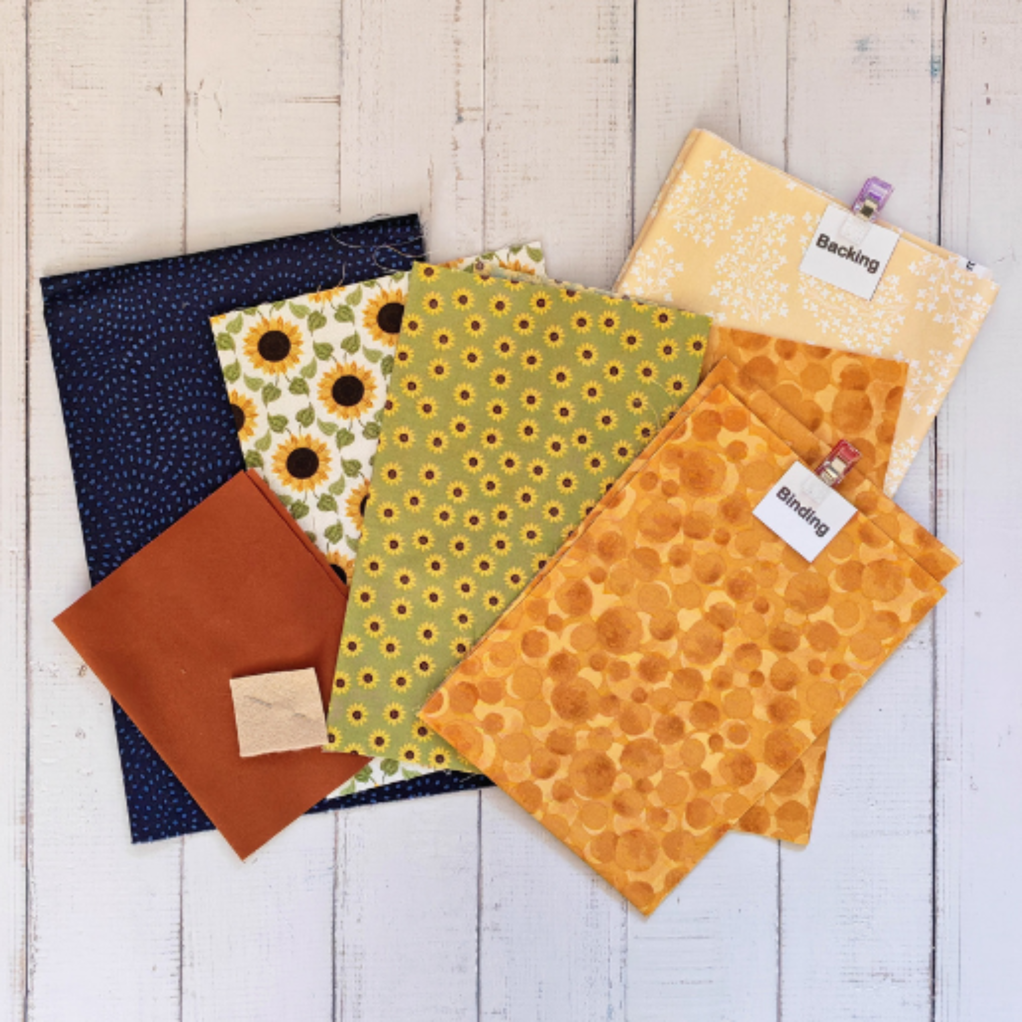 Assortment of cotton fabrics, blue, yellow and green