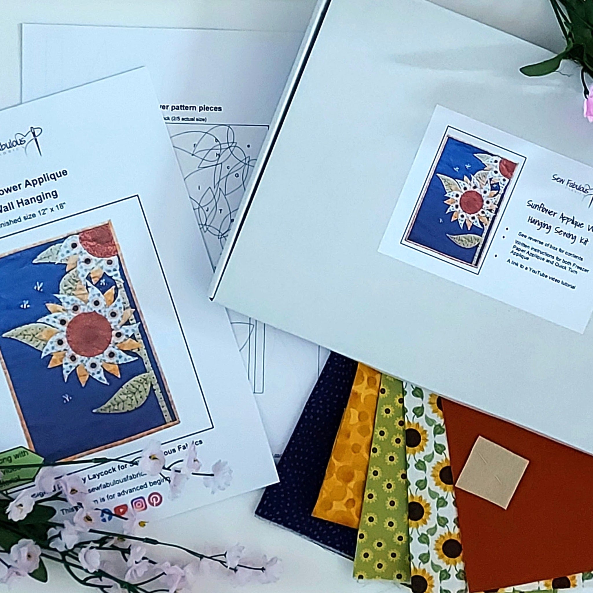 White box containig fabrics and pattern to stitch a Sunflower Applique Wall Hanging