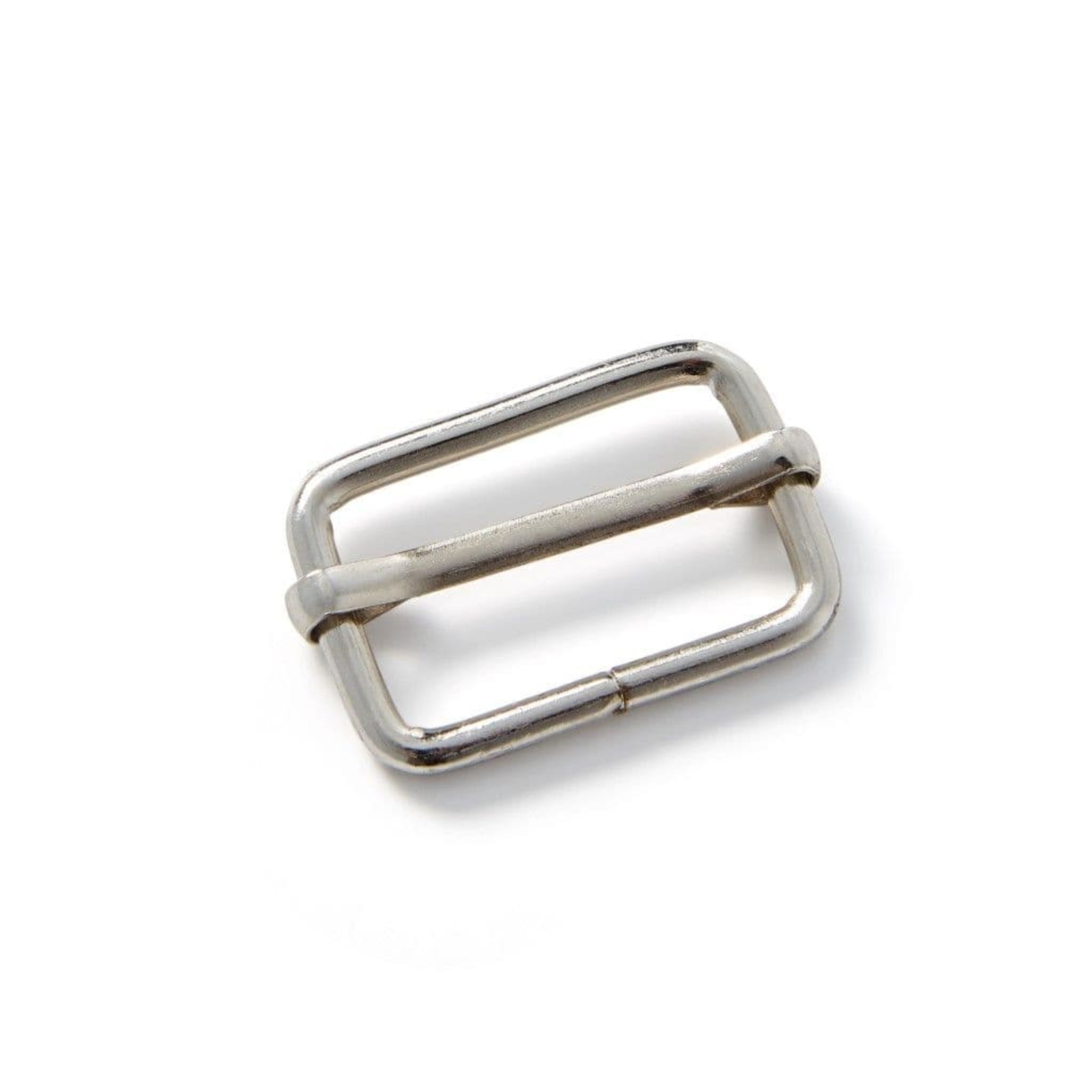 Silver metal buckle on a white background