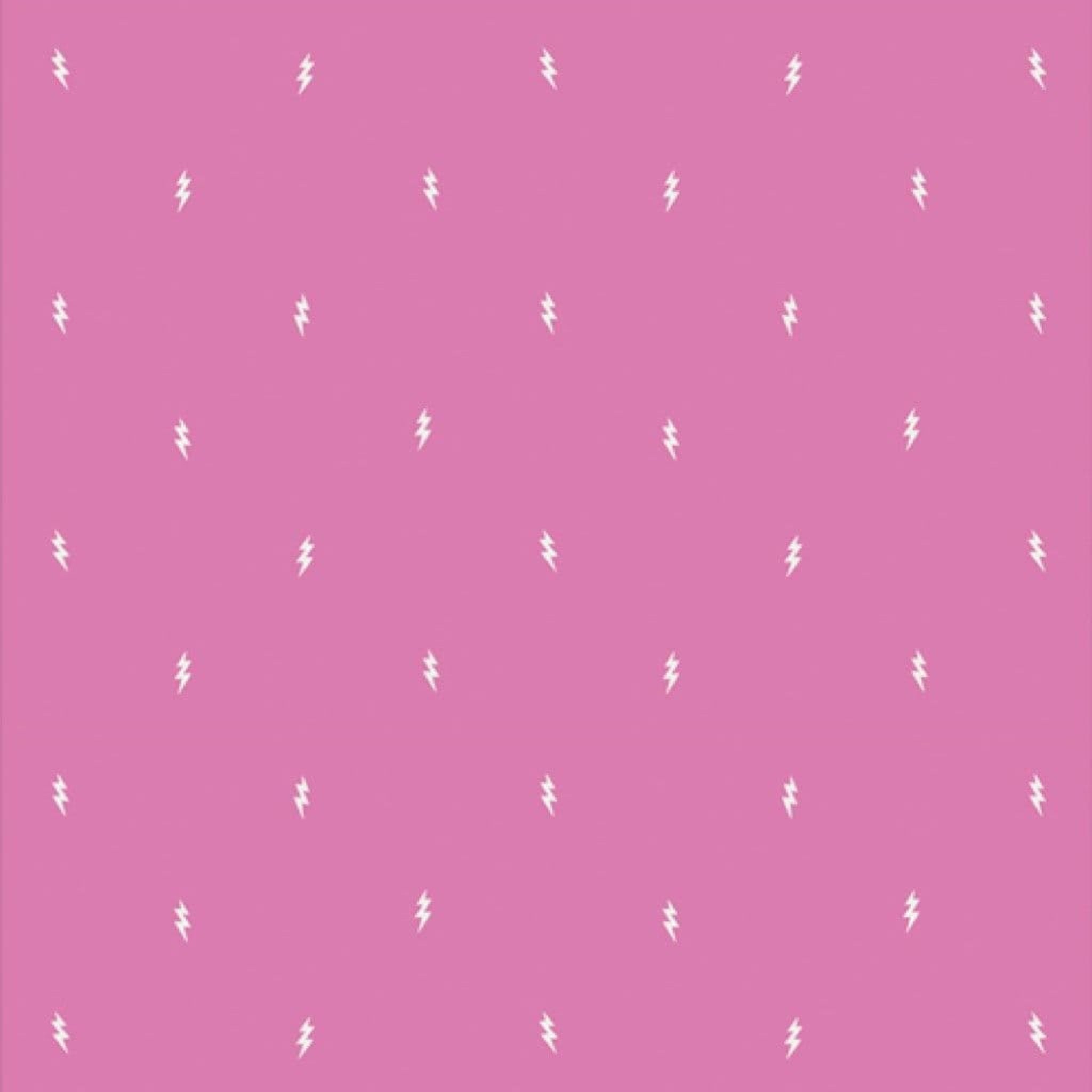 Pink background with white lightening bolts 100% cotton fabric.