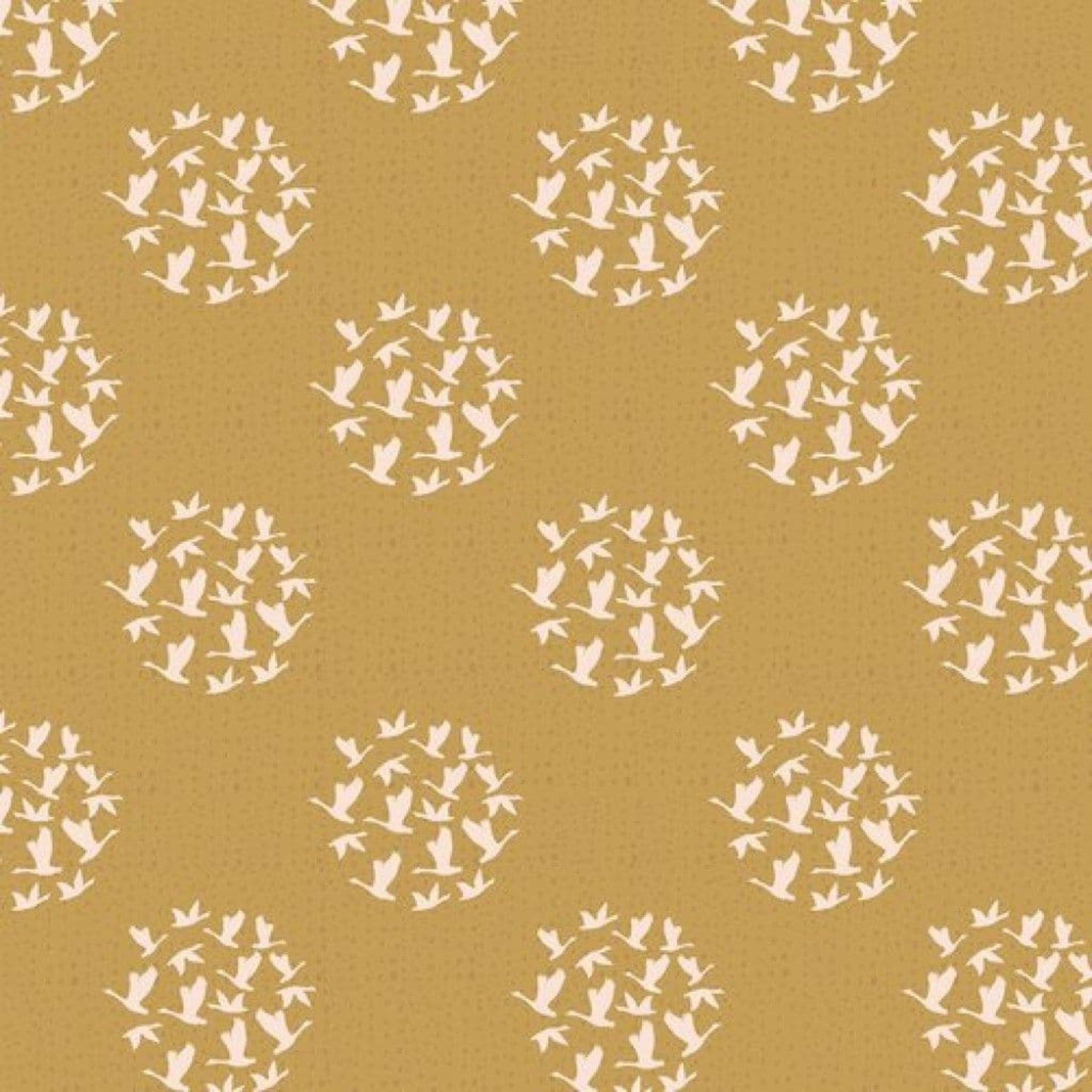 Pattern of white birds in circular formations on a mustard yellow background. 100% cotton fabric.