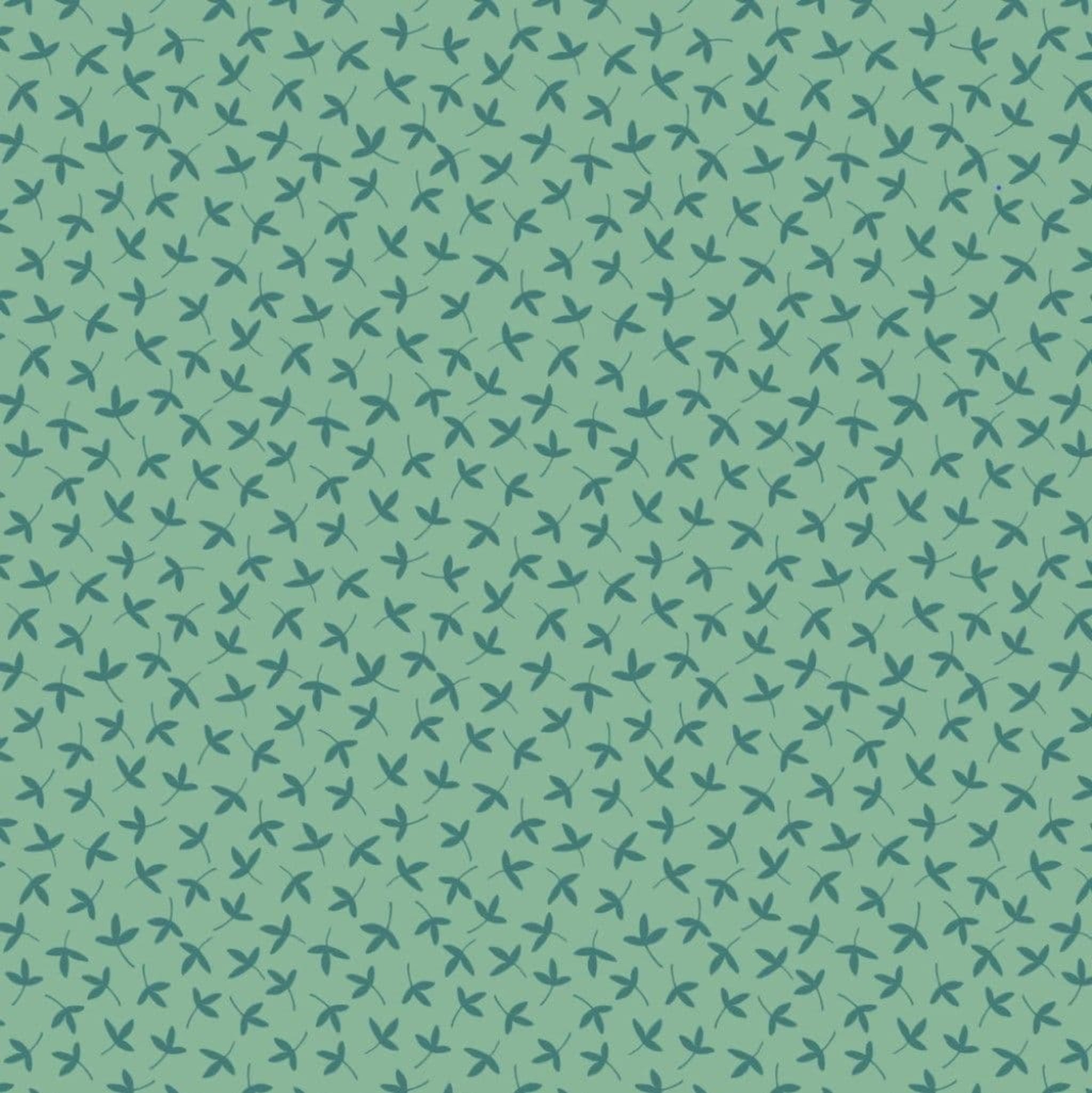 Pattern of small green leaves on a teal background. 100% cotton fabric