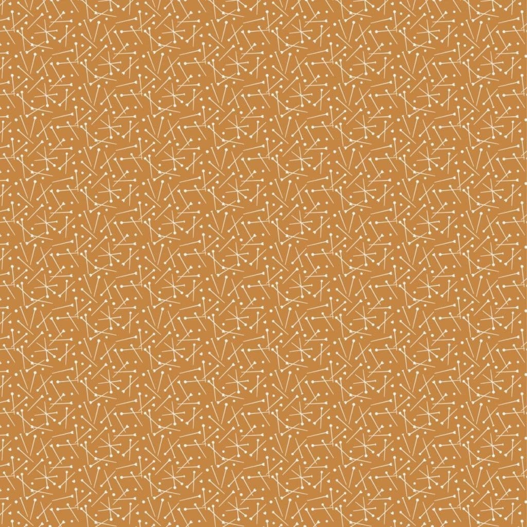 Gold coloured fabric with pattern of sewing pins. 100% cotton fabric.