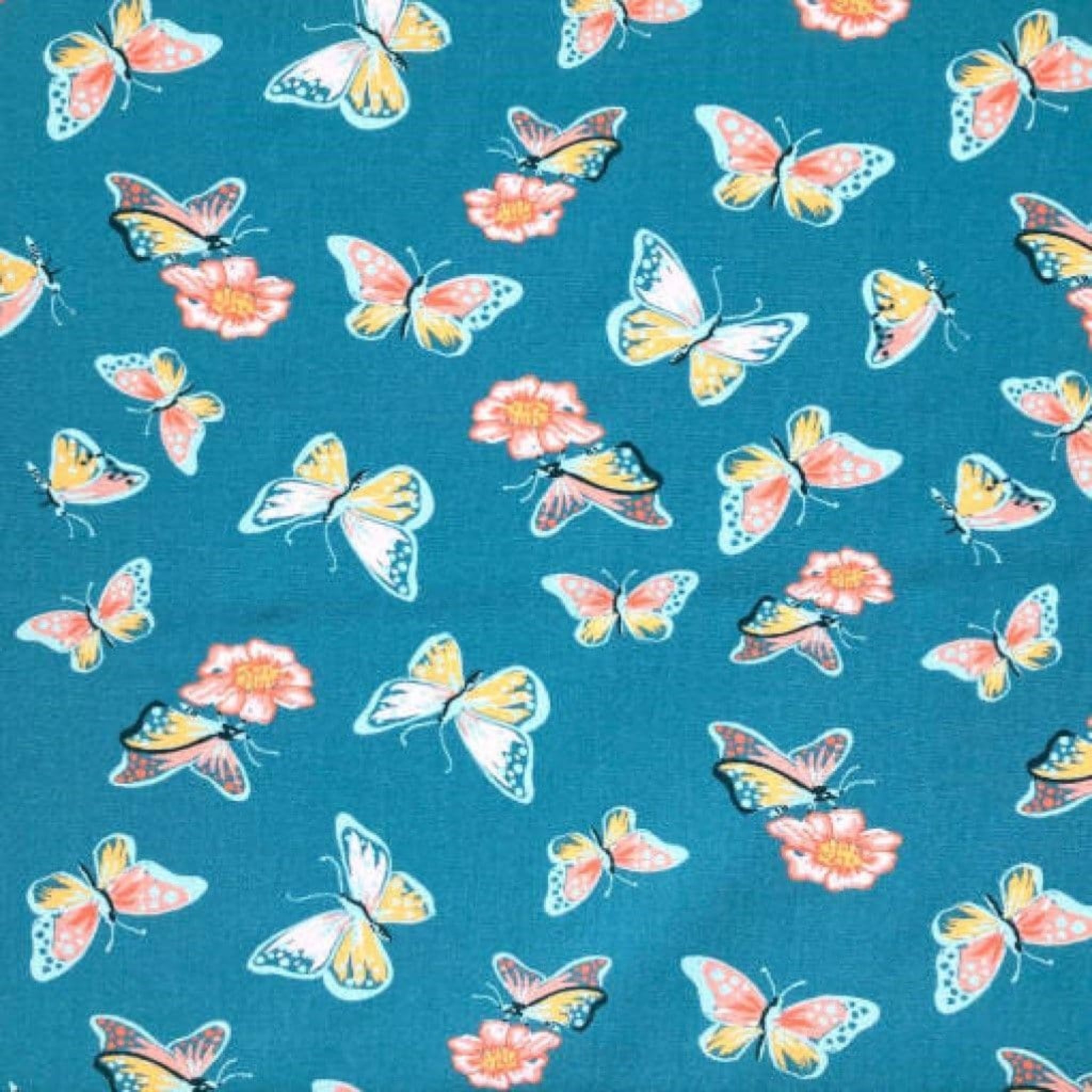 Butterfly and flower pattern on a blue background. 100% cotton fabric.